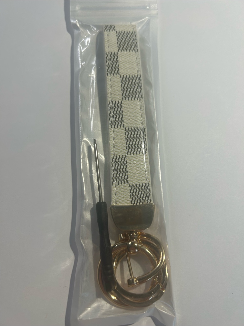 Checkered White Wristlet Keychain with Gold Hardware